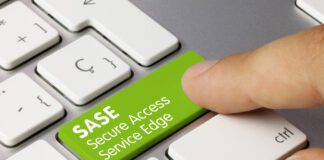 SASE Secure Access Service Edge inscription on green keyboard.