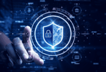 Man accessing a computer device with a protective shield against cyber threats.