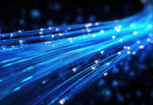 Glowing blue strands of fiber optic cables illustrating digital connectivity.